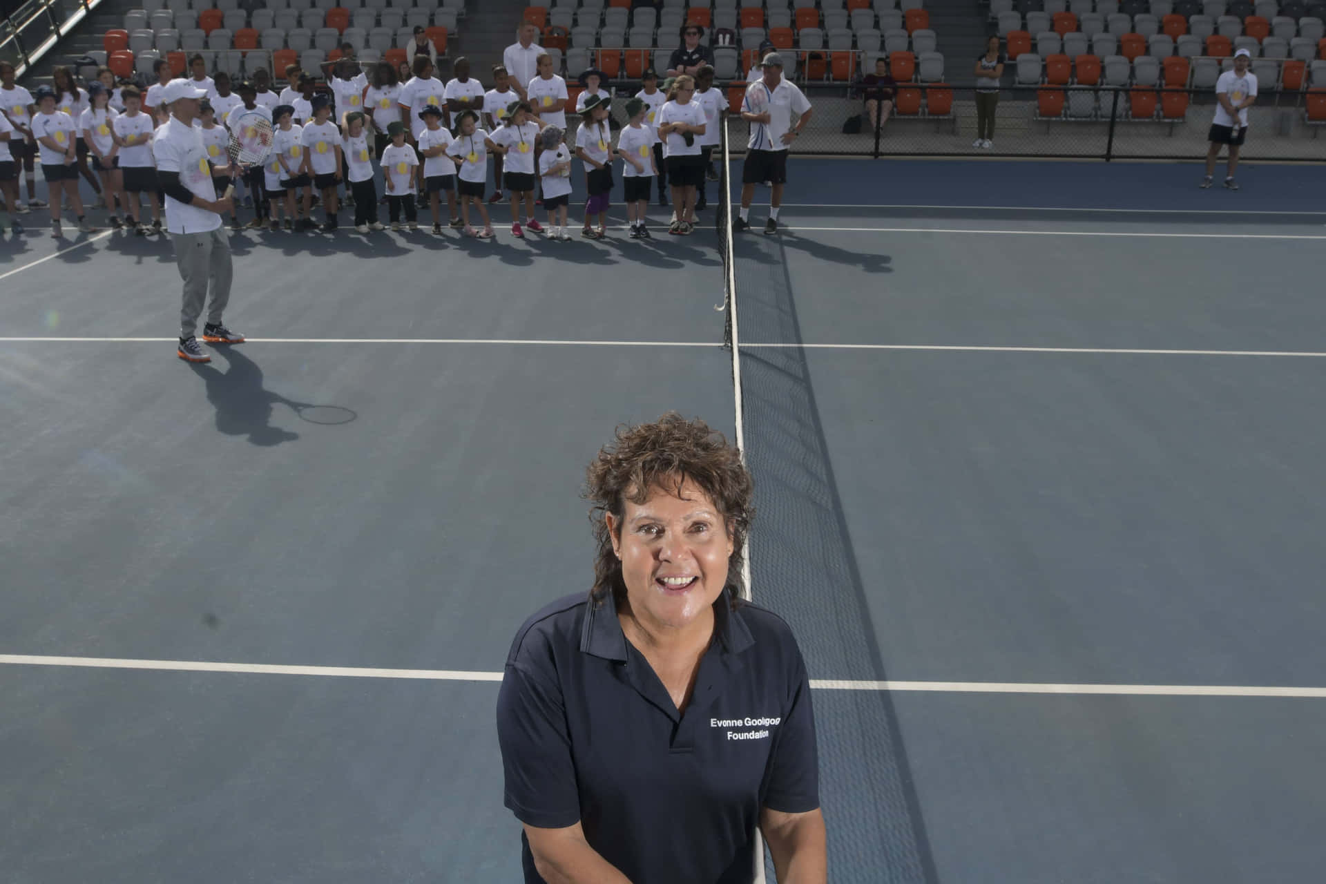 Evonne Goolagong Cawley With Young Tennis Players Wallpaper