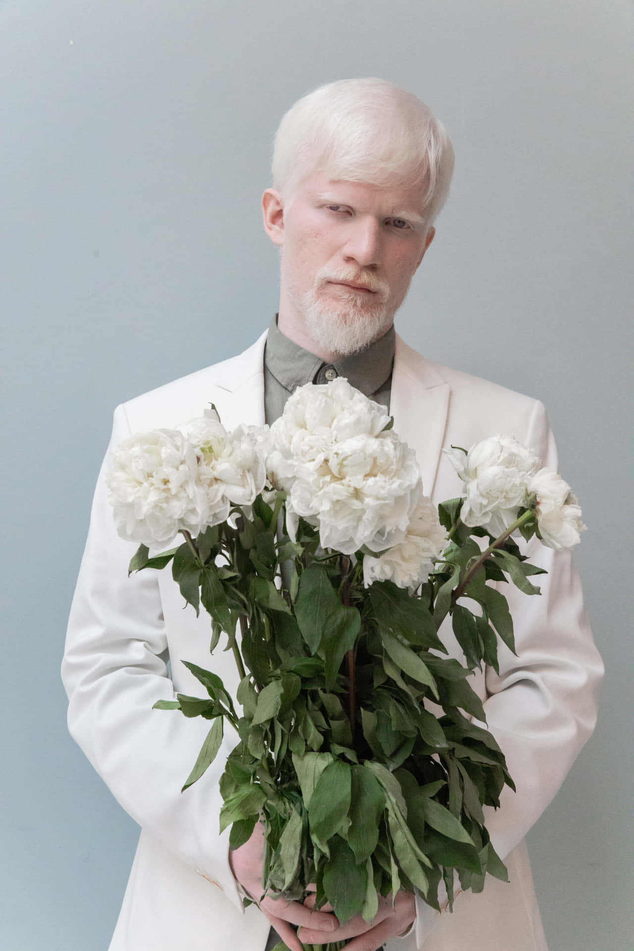 Exceptional Albino Man Holding Flowers Wallpaper