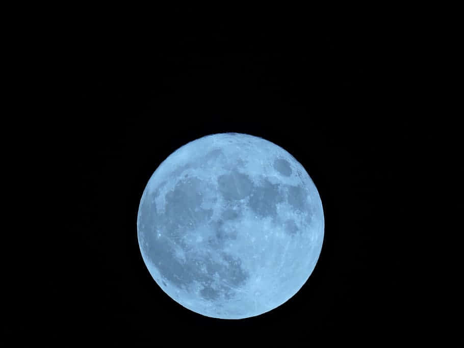 Exceptional Full Moon Illuminating The Night Sky Wallpaper