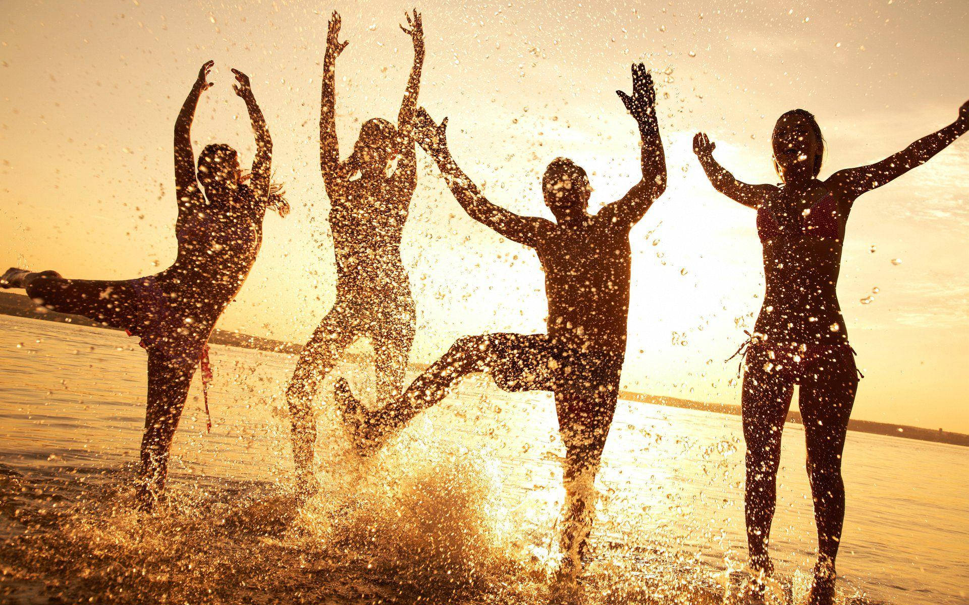 Excited Group At The Beach Wallpaper