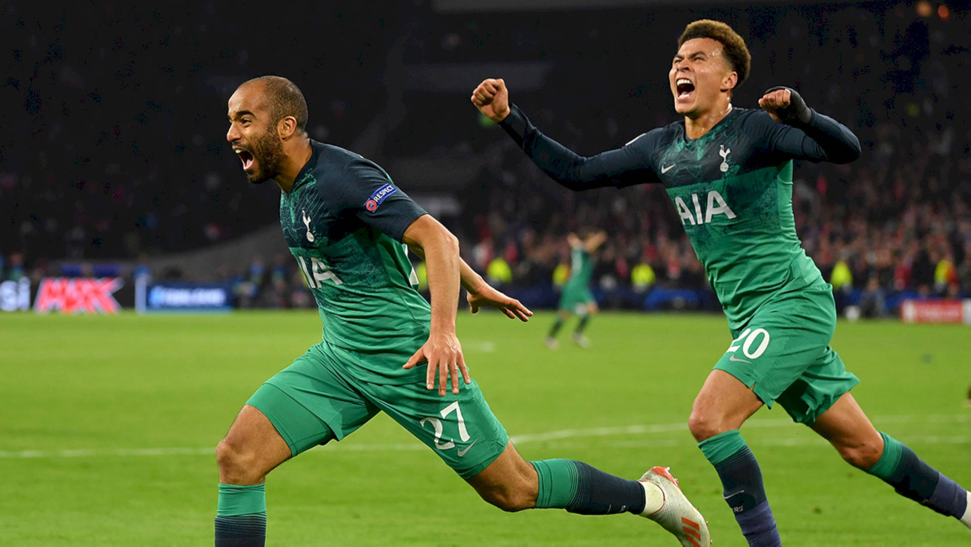Excited Lucas Moura Running With Teammate Wallpaper