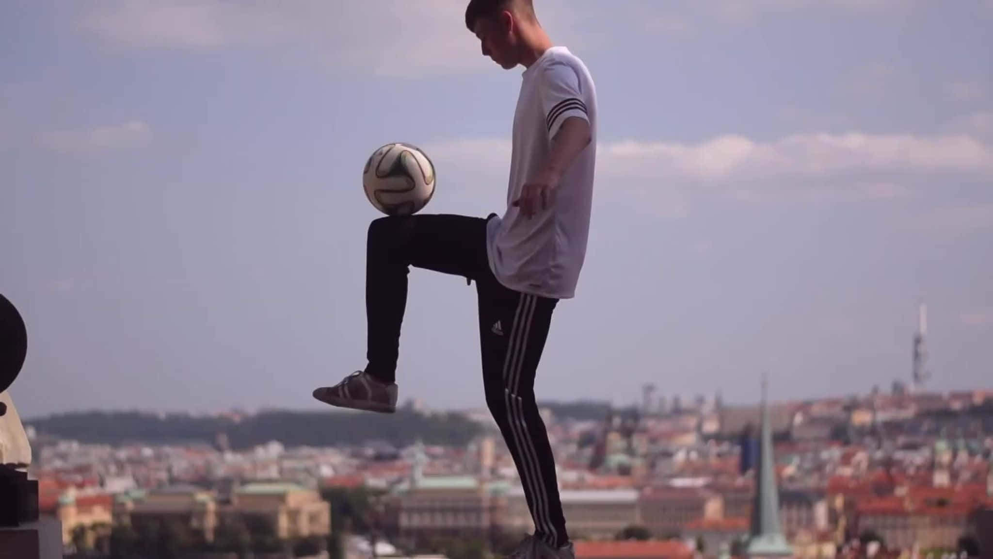 Exciting Freestyle Soccer Trick Performance Wallpaper
