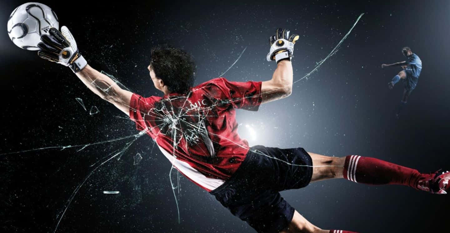 Exciting Moment Of Goalkeeper In Action Wallpaper
