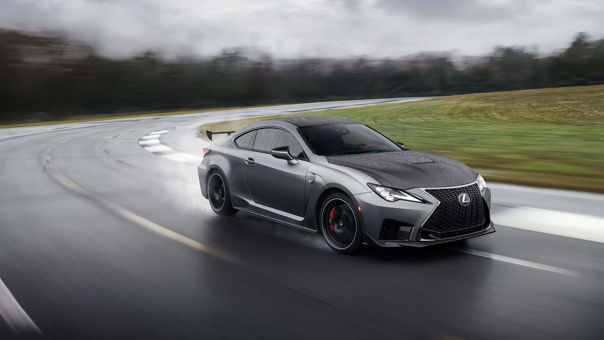 Executive Style Meets Raw Power: The Lexus Rc Coupe In Vibrant Action Wallpaper