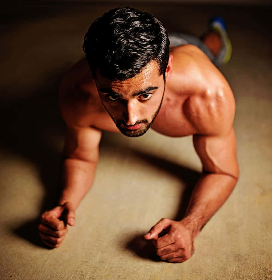 Exercising Fit Topless Indian Guy Wallpaper