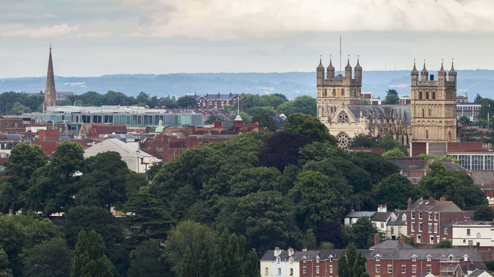 Exeter's Adembenemende Dageraad Over De Majestueuze Stad Achtergrond