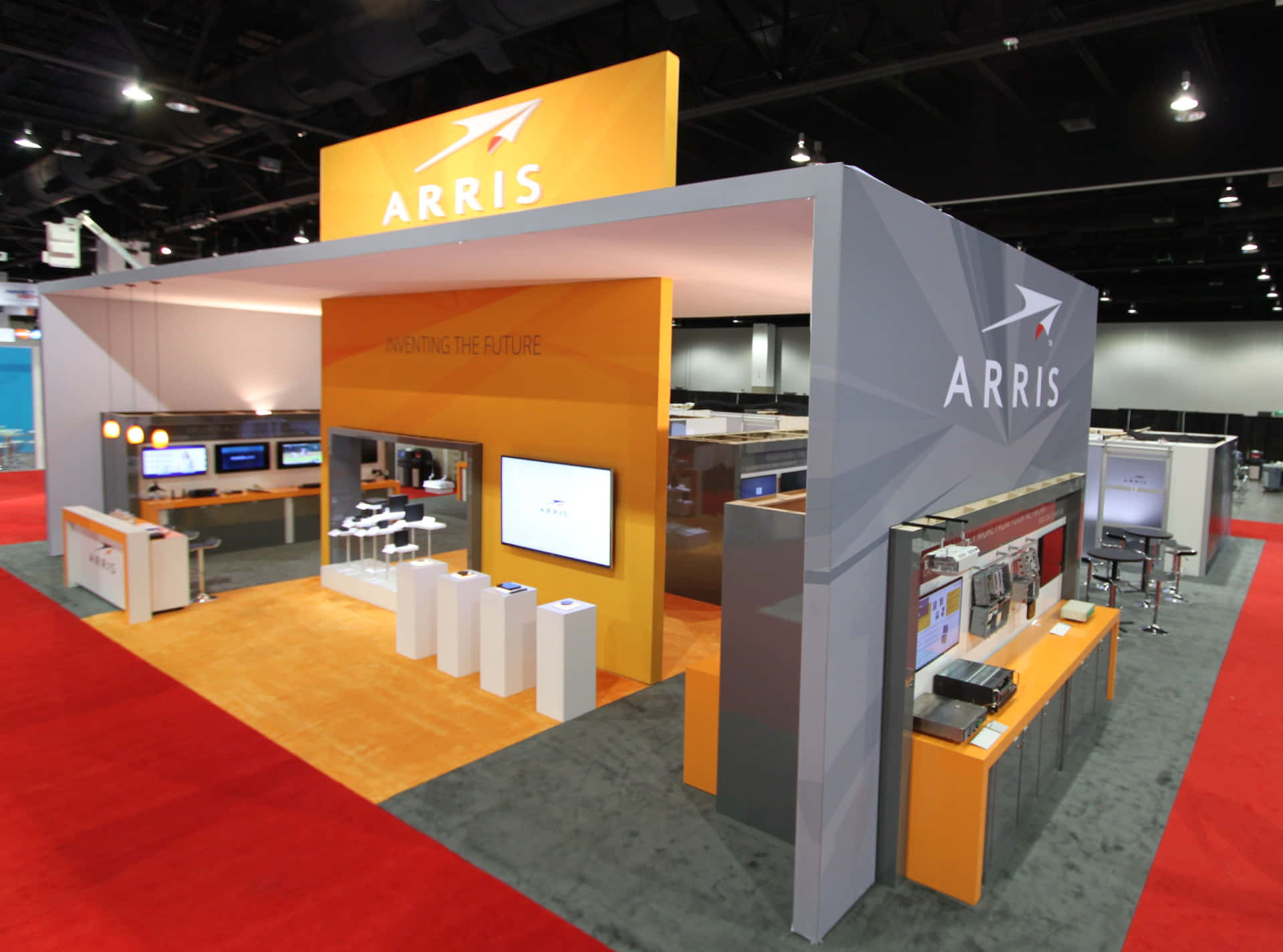 A group of people and trading booth at an Exhibition Wallpaper