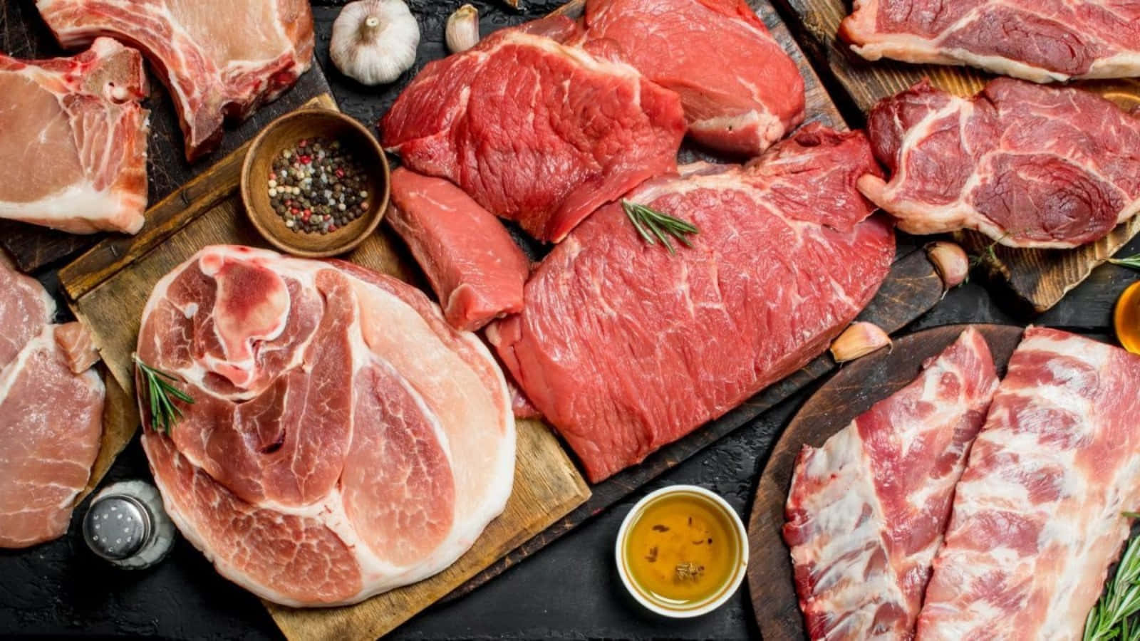 Exquisite Gourmet Meat Assortment On A Rustic Wooden Board.