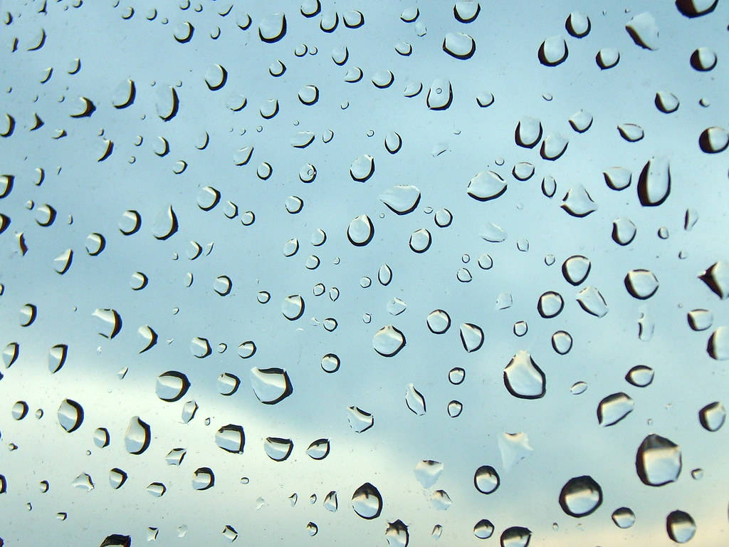 Extremenahaufnahme Von Regentropfen Auf Glas Wallpaper