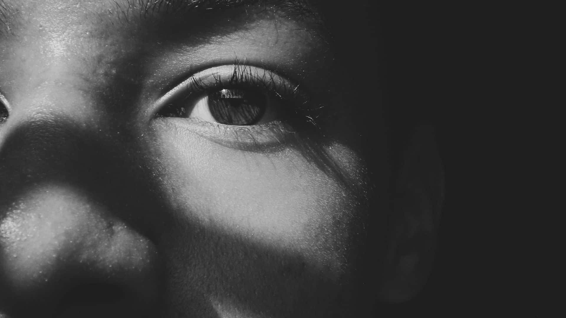 A Black And White Photo Of A Person's Eye
