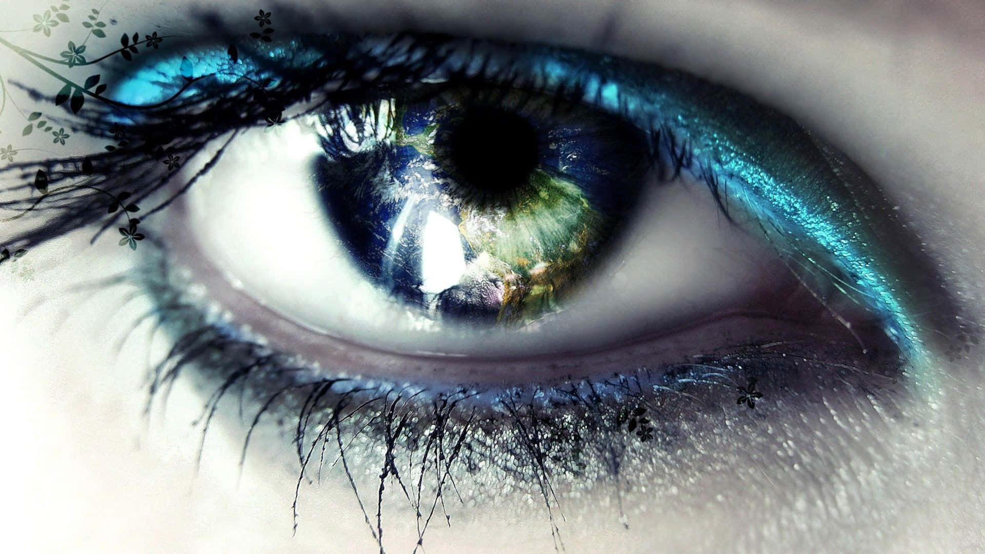 Caption: Mesmerizing Closeup of an Eye with Metallic Blue Liners Wallpaper