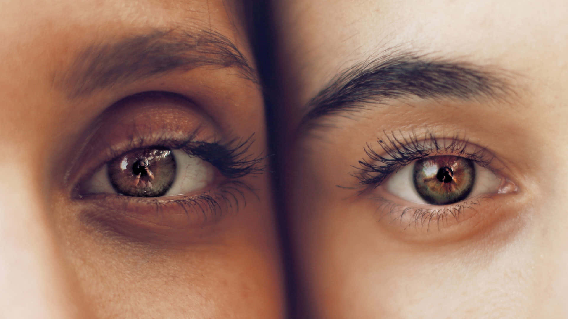 Two Women With Brown Eyes Looking At Each Other
