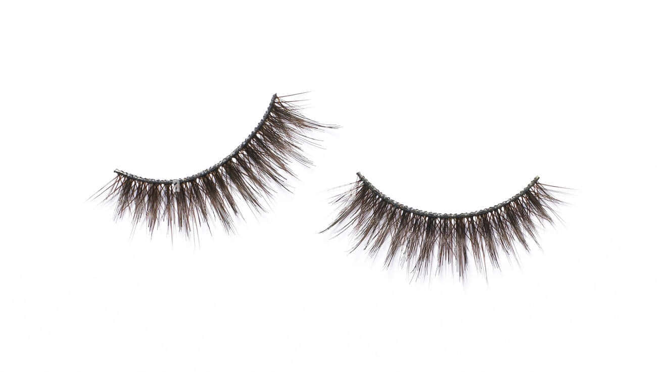 Two False Lashes On A White Background