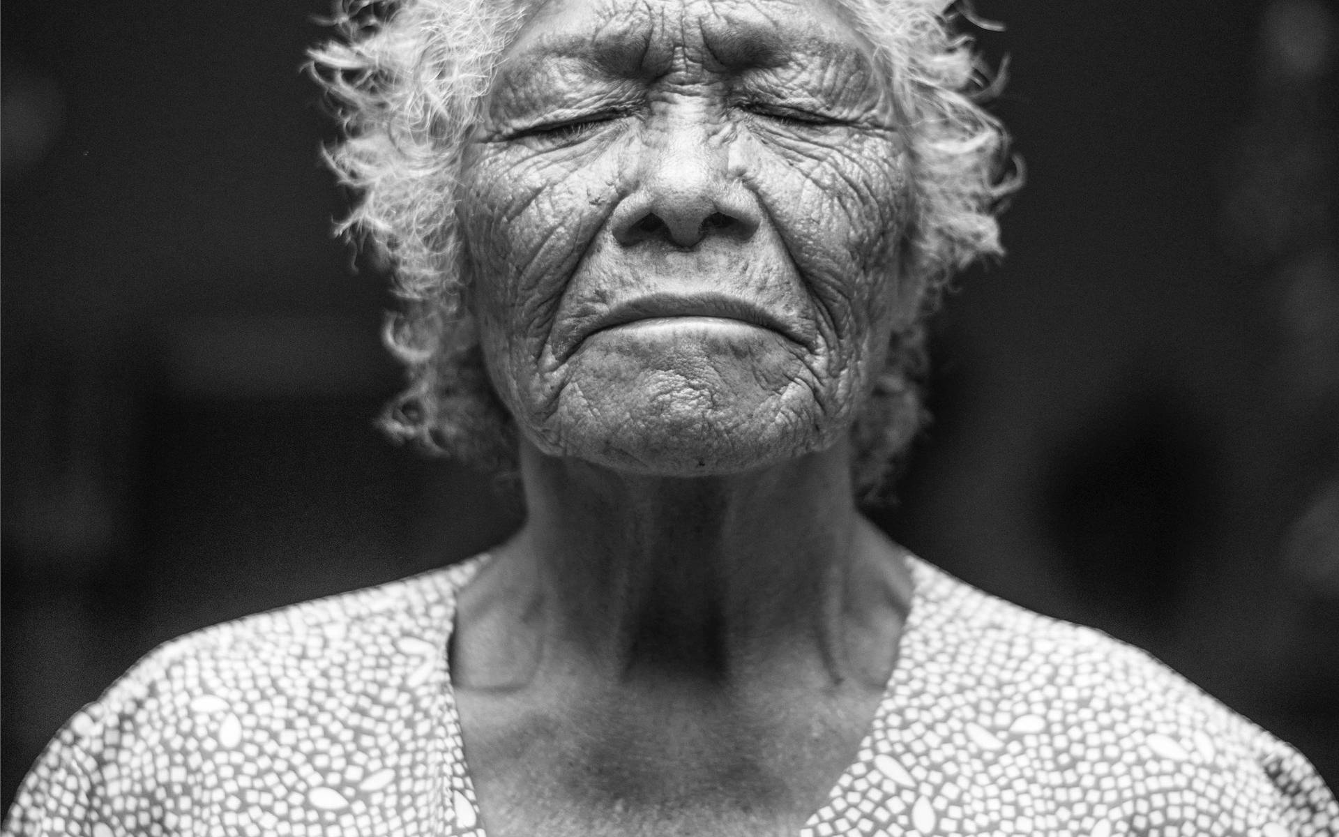 Eyes Closed Beautiful Older Woman Wallpaper