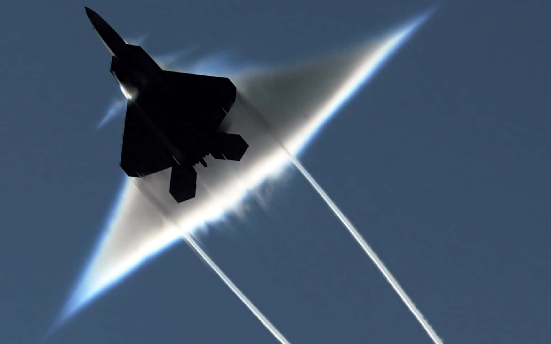 Uncaccia F-22 Raptor Dell'us Air Force Esegue Acrobazie Aeree Durante Un Airshow. Sfondo