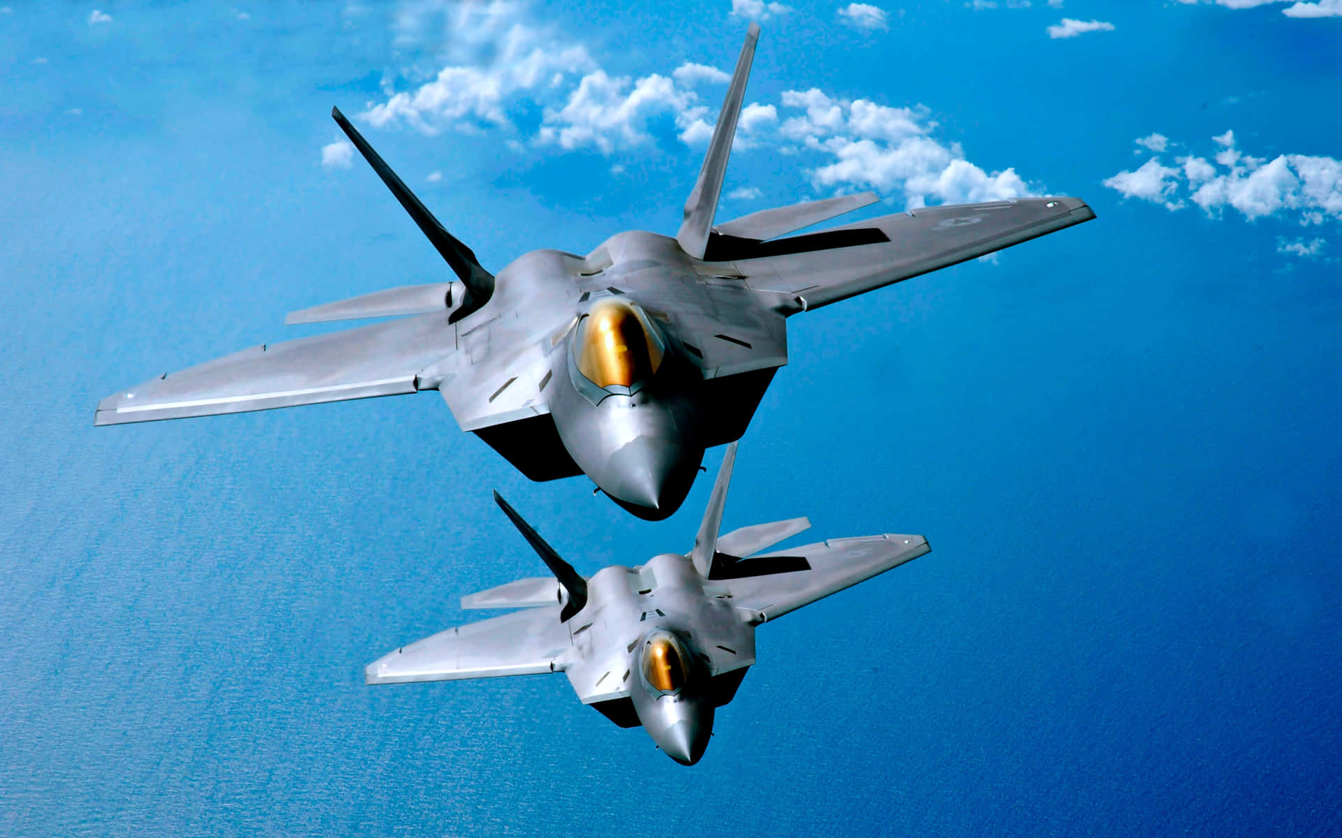 Den kraftfulde F-22 Raptor Fighters Jet Tapet Wallpaper