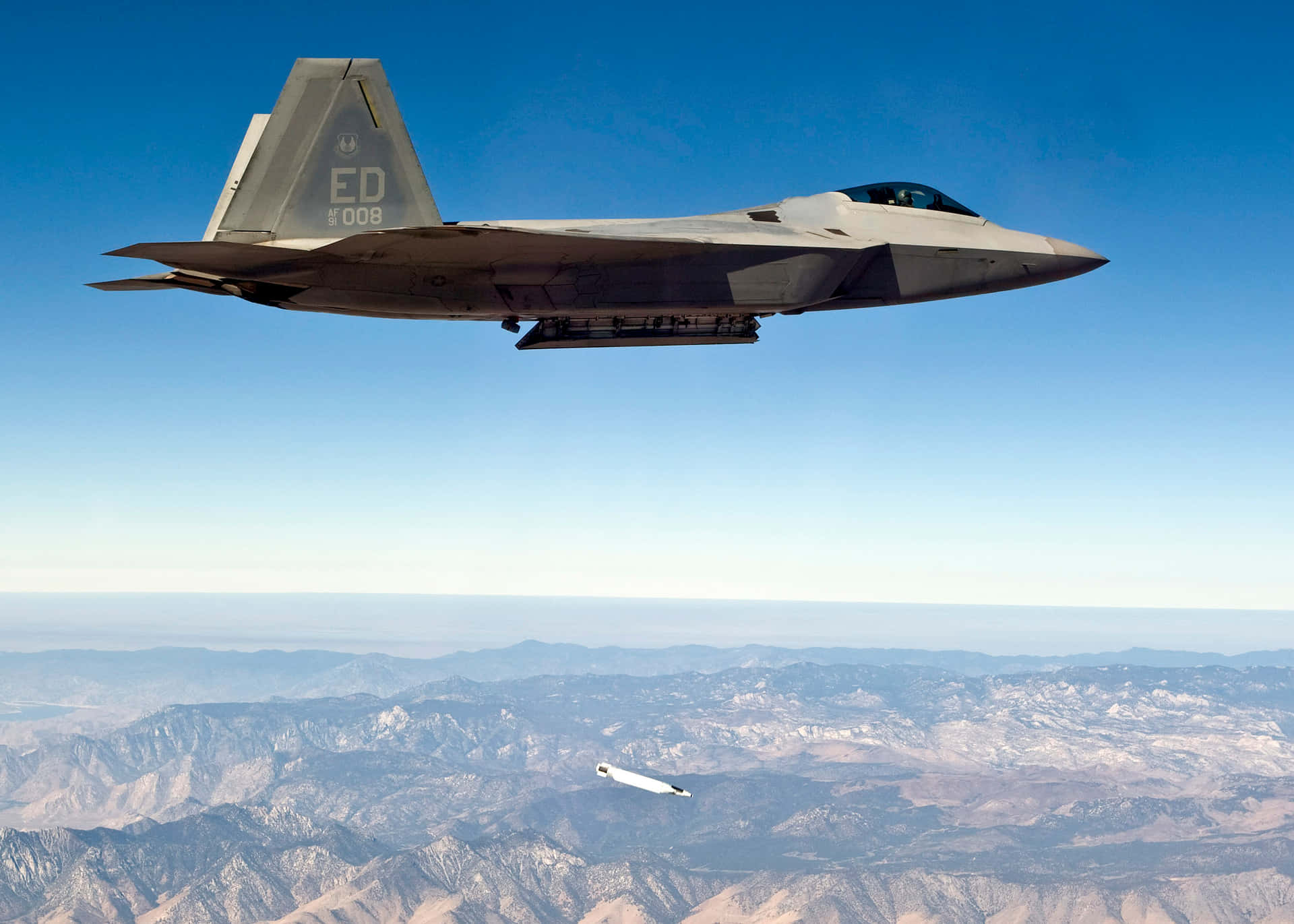 Majestic F-22 Raptor Soars Over the United States Wallpaper