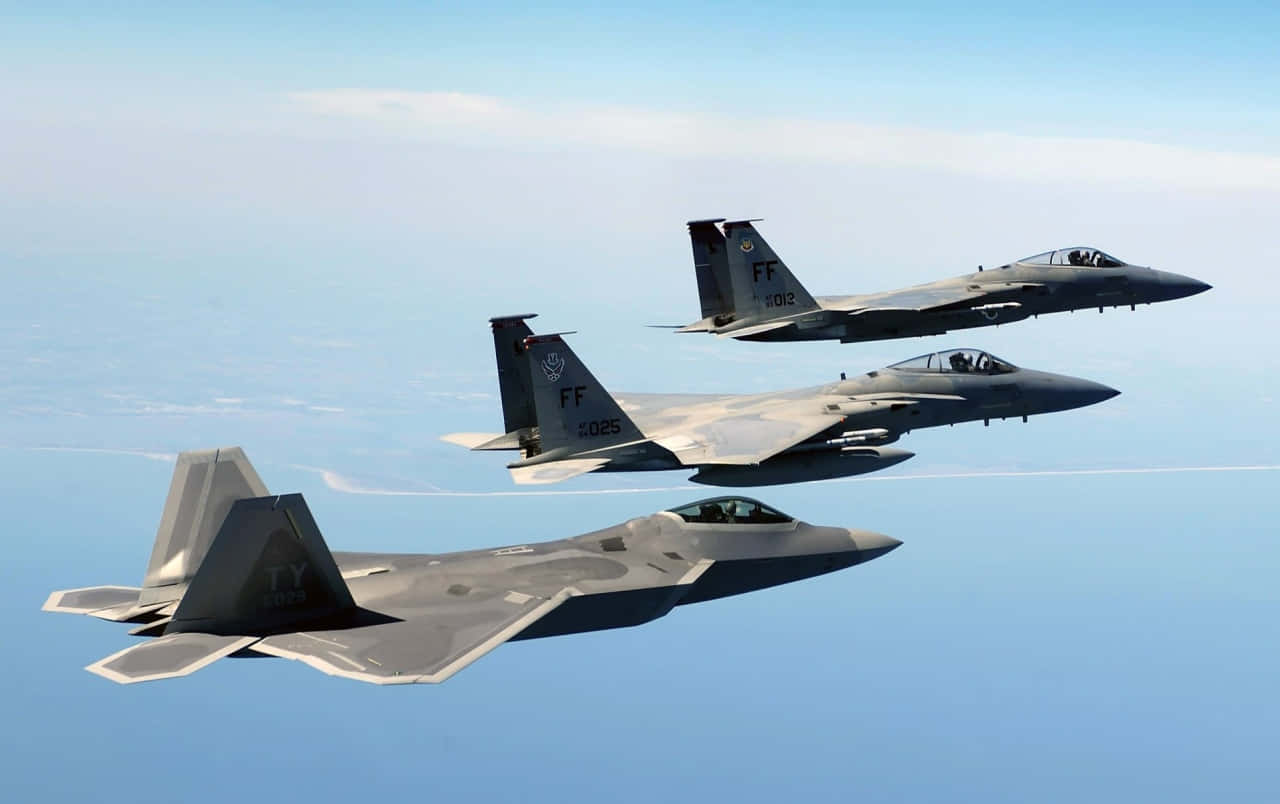 F-22 Raptor Tearing through the Skies Wallpaper
