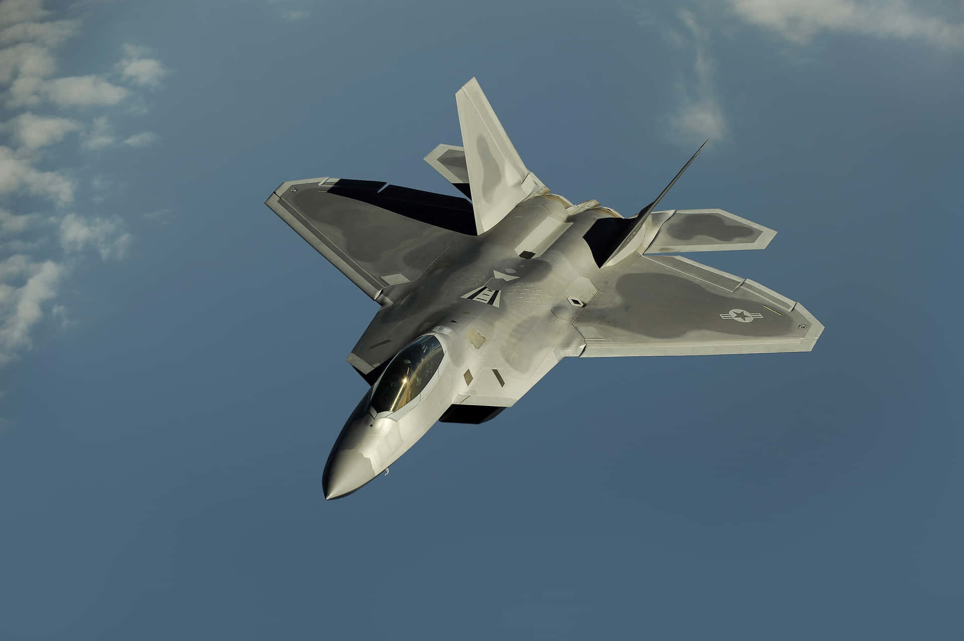 The Powerful F-22 Raptor Flying High Wallpaper