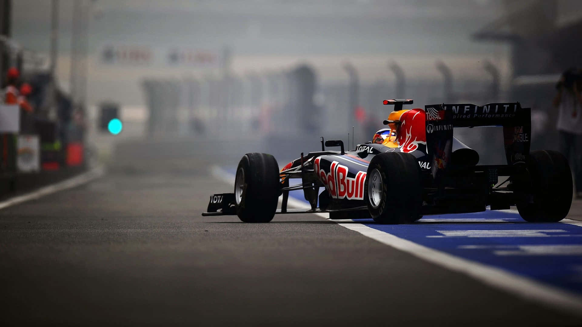 Red Bull Racing Car Driving On A Track