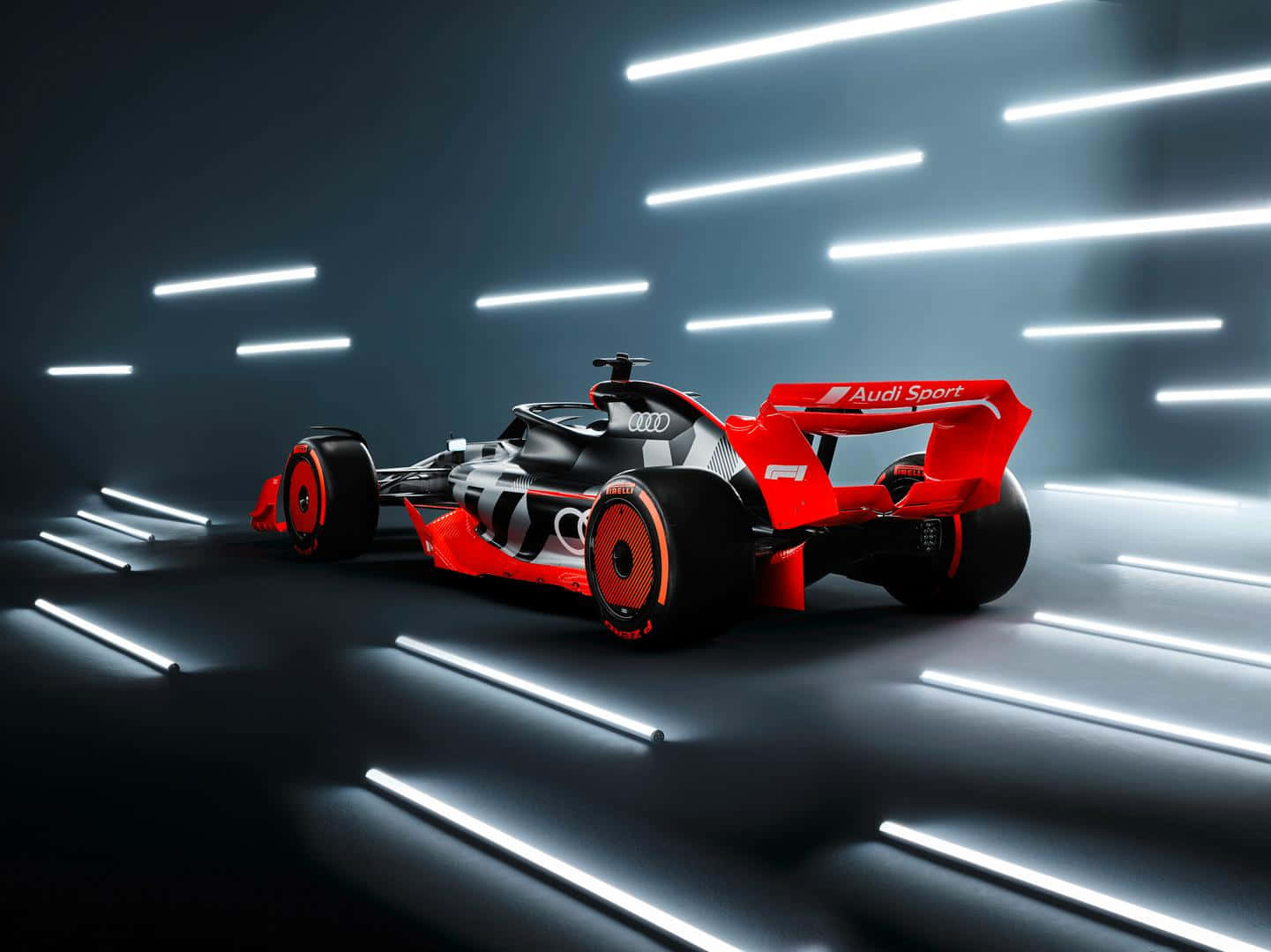 A Racing Car Is Shown In A Dark Room