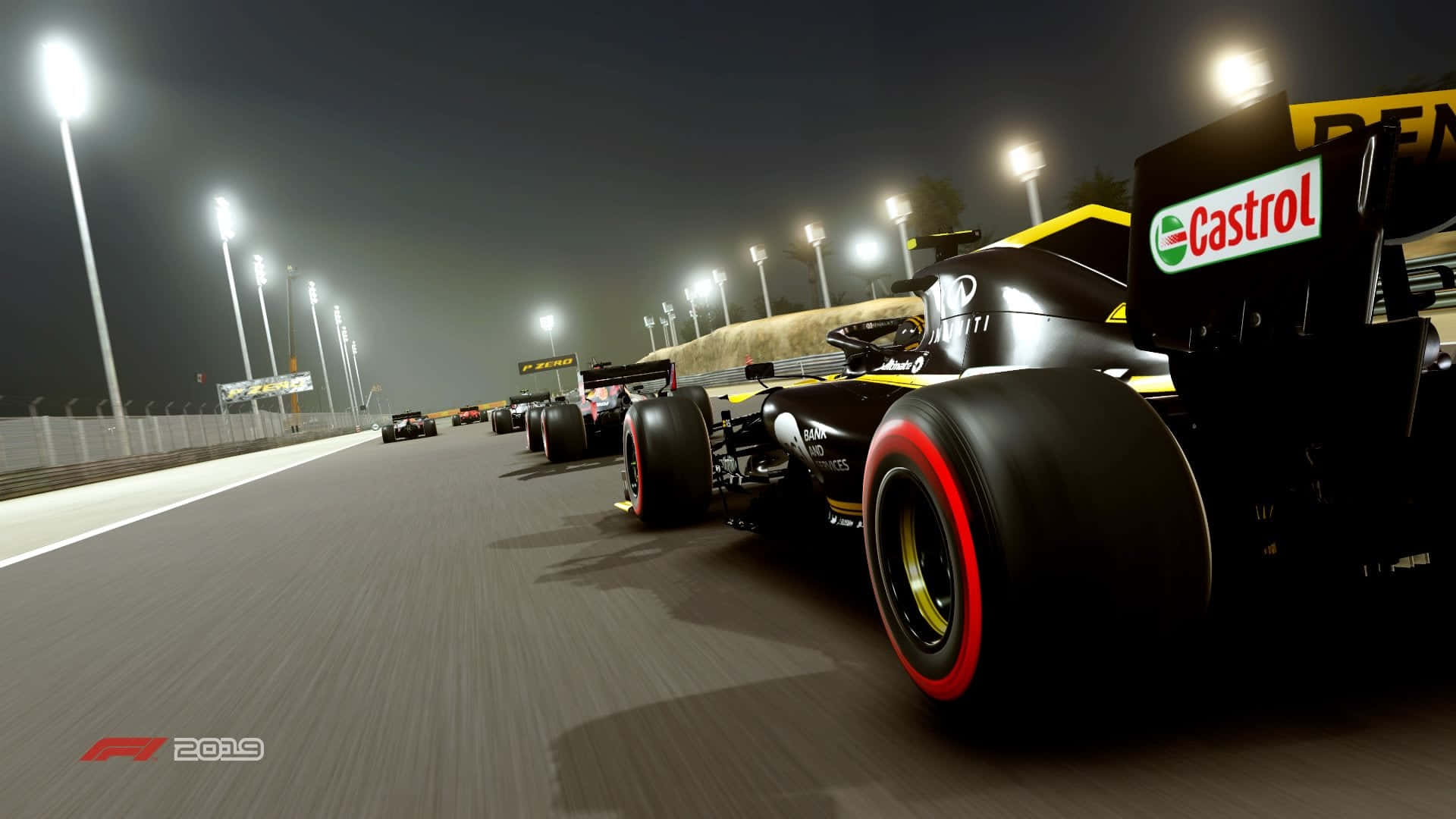 A Race Car Driving Down A Track At Night