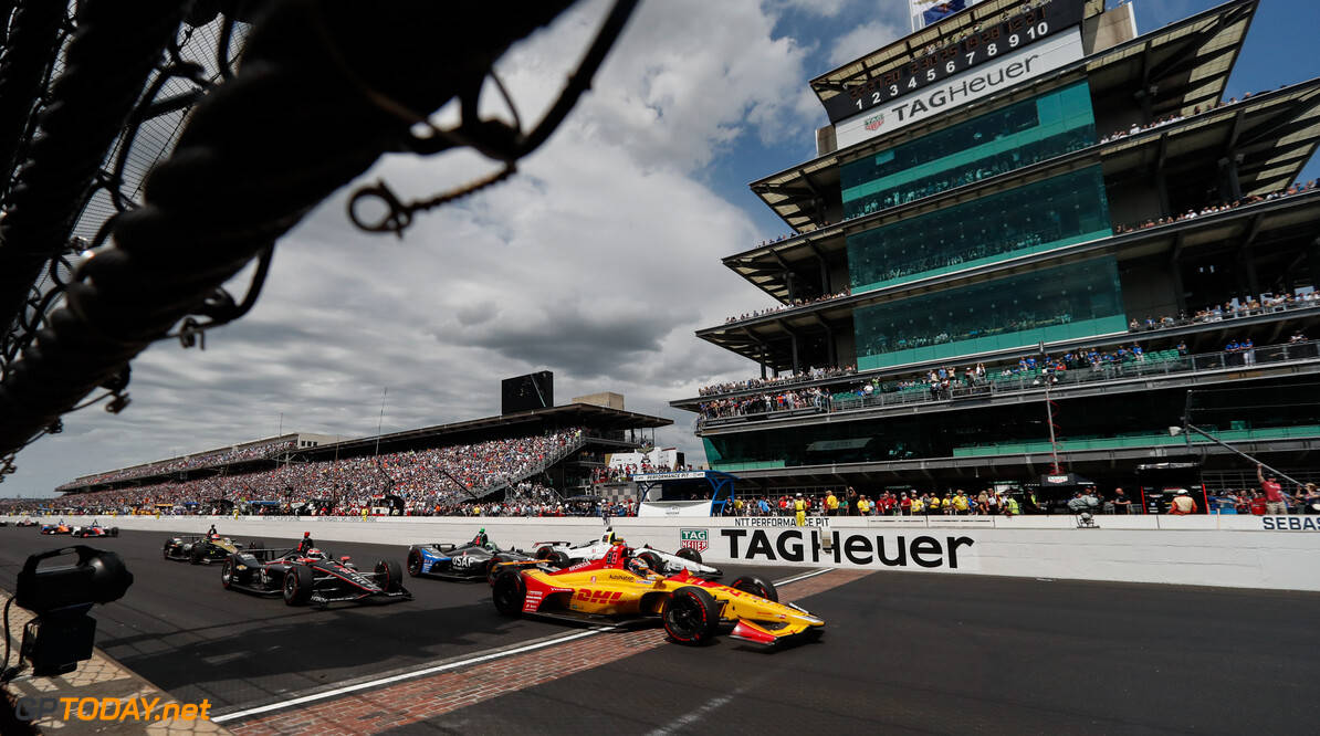 Thrilling Speed - F1 Cars at the Indianapolis 500 Event Wallpaper