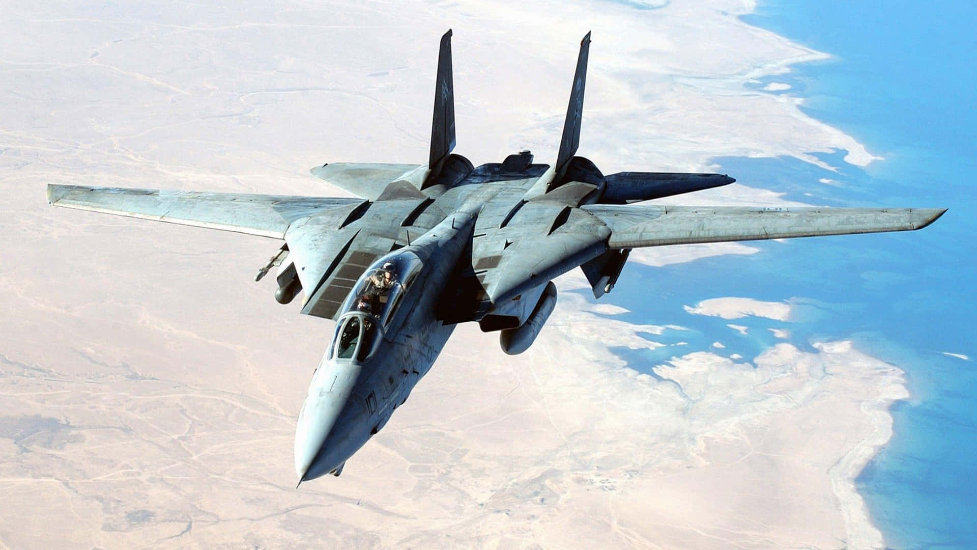 F14 Jet In Flight Over Desert Wallpaper