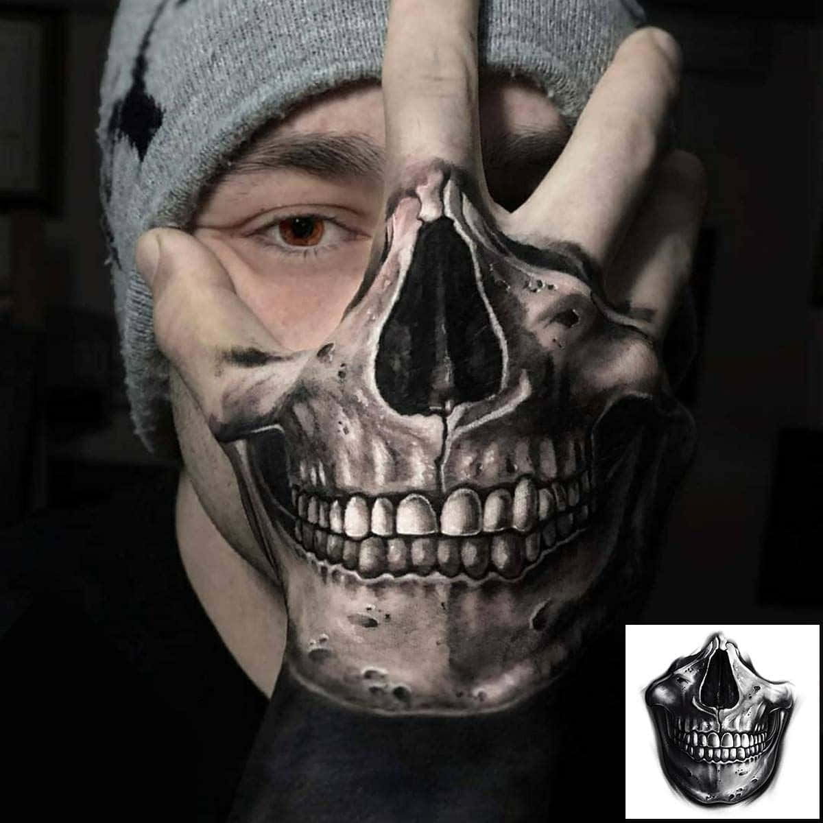 Download A Man With A Skull Tattoo On His Hand | Wallpapers.com