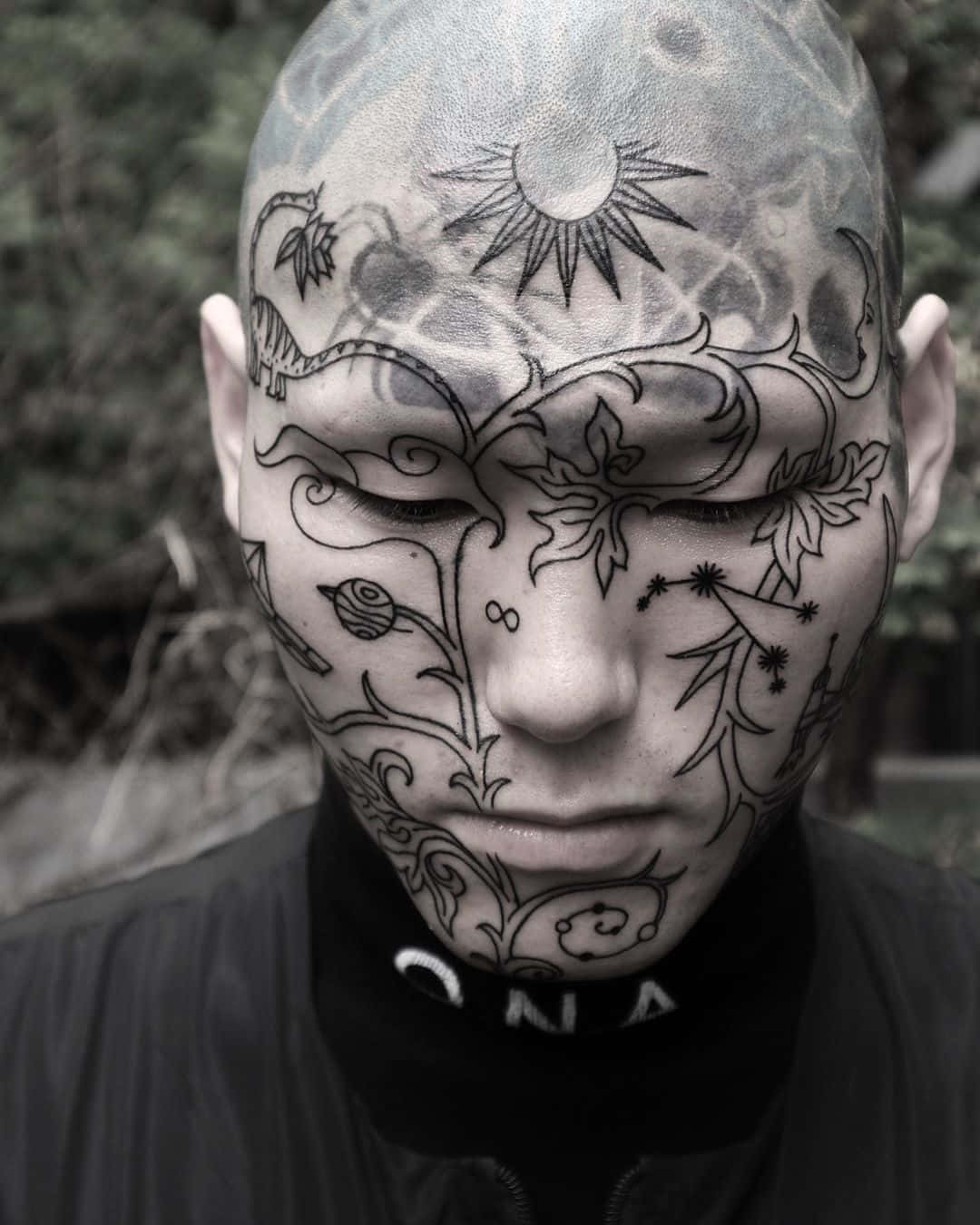A Man With A Tattoo On His Head