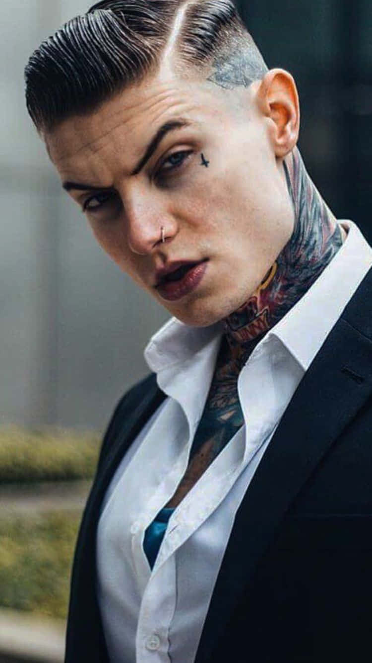 A Man With Tattoos On His Neck And Shoulders