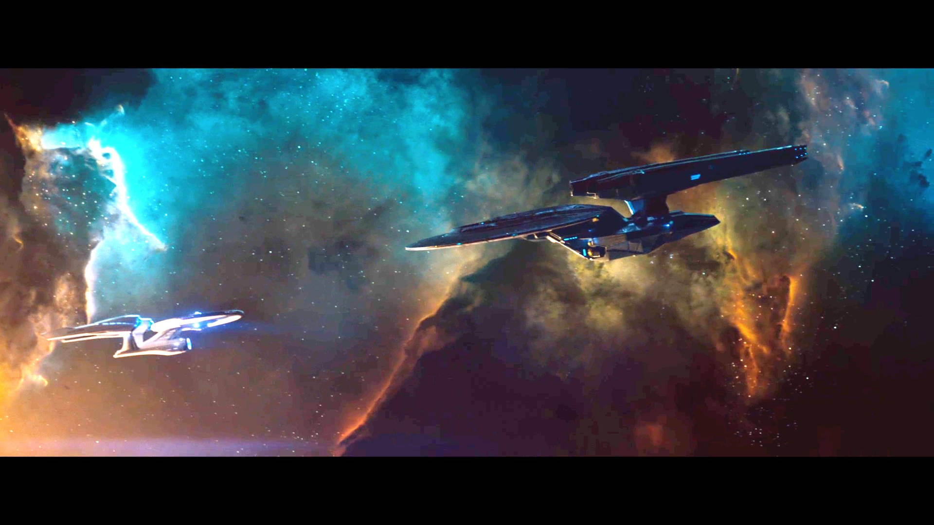 Wallpaper of faceoff of two spaceships in Star Trek. 