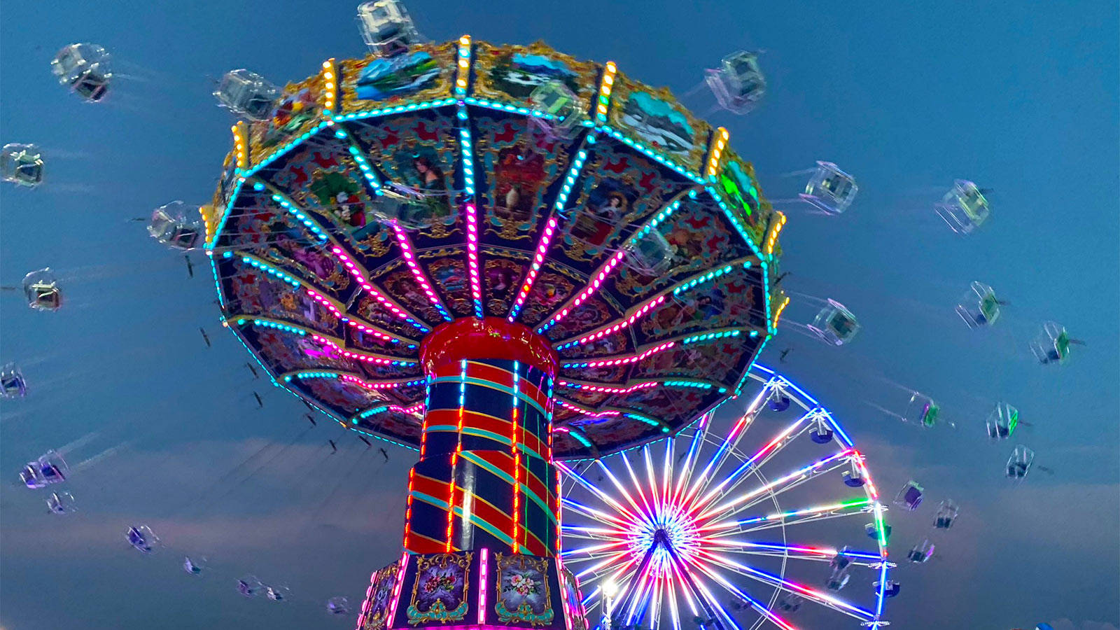 Fair Swing Ride And Ferris Wheel Wallpaper