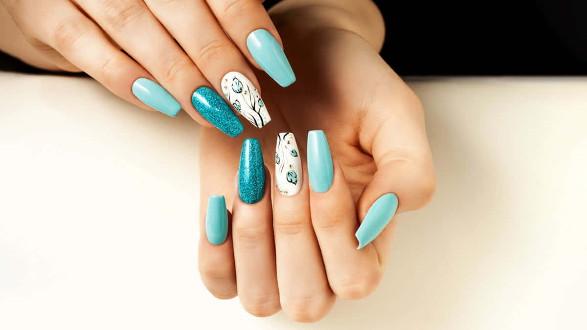 A Woman With Blue And White Nails Holding A Blue And White Nail Art