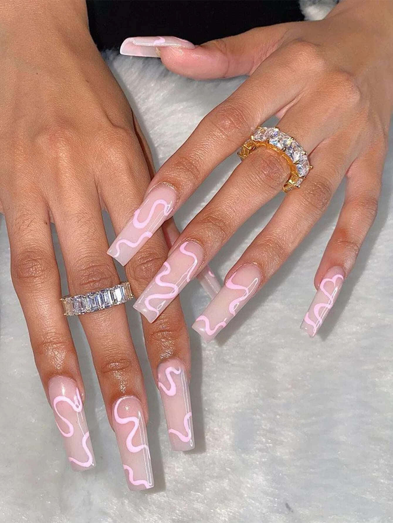 A Woman With Pink Nails And Rings