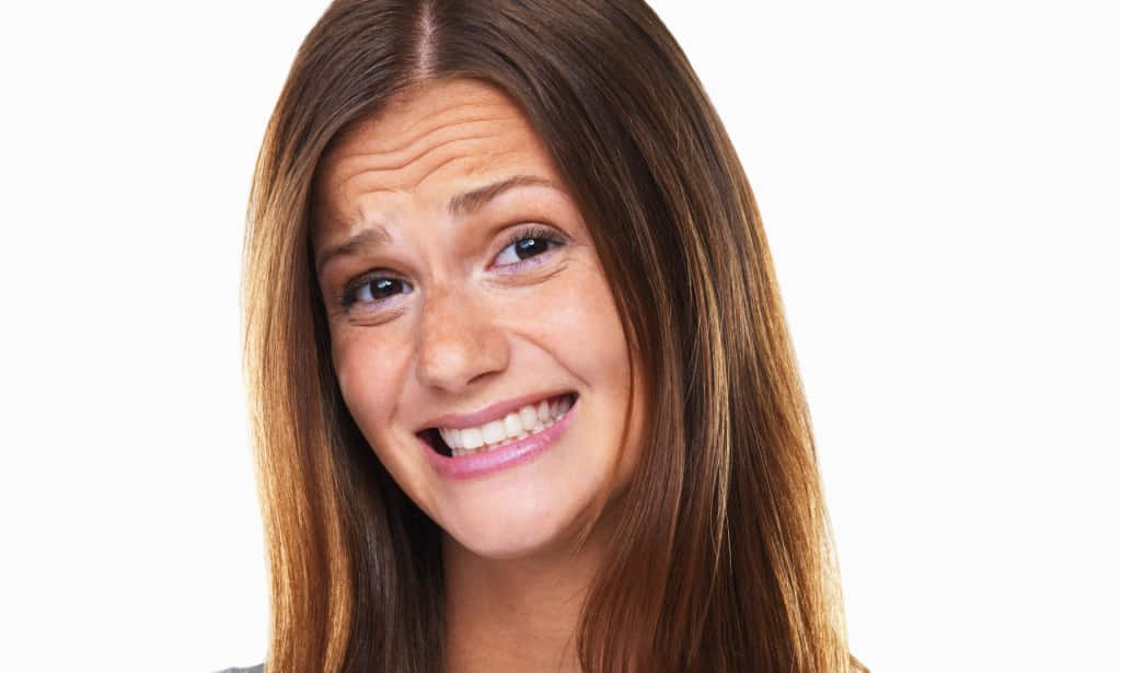 A Woman With Long Hair Is Smiling