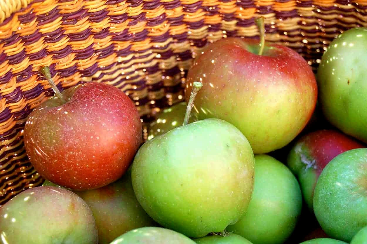 A Basket of Fresh Autumn Apples Wallpaper