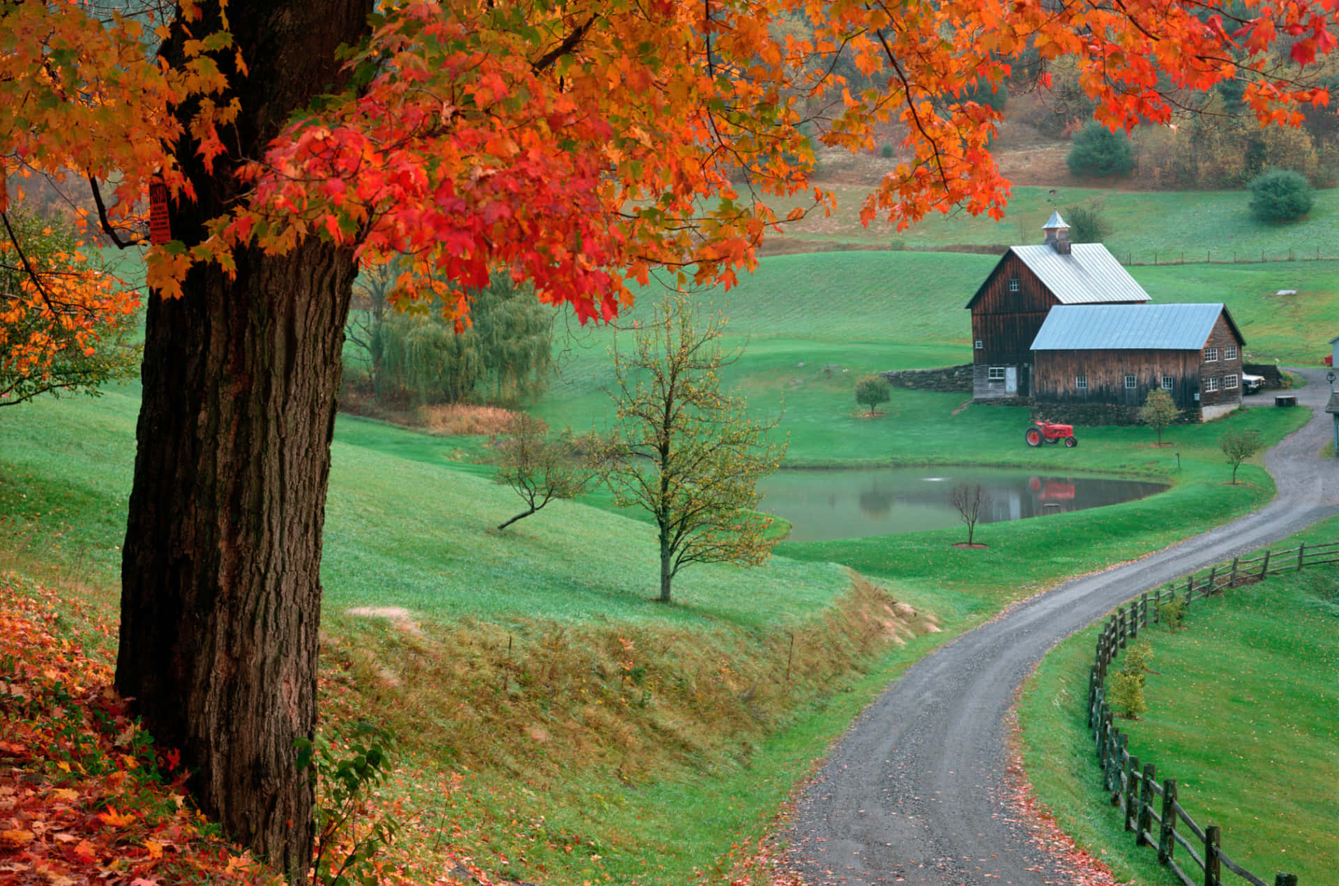A picturesque Fall Barn surrounded by vibrant autumn foliage Wallpaper