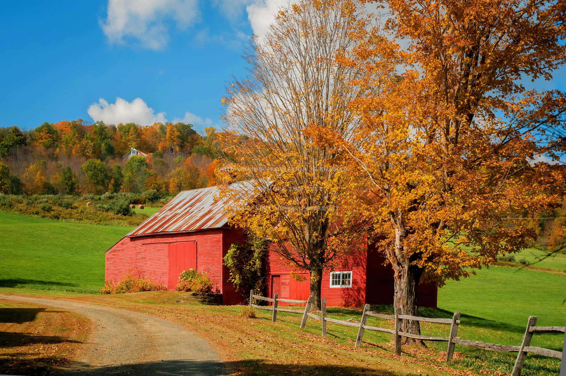 Fall Barn amidst picturesque autumn landscape Wallpaper