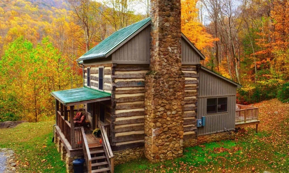 A Peaceful Fall Cabin in the Woods Wallpaper