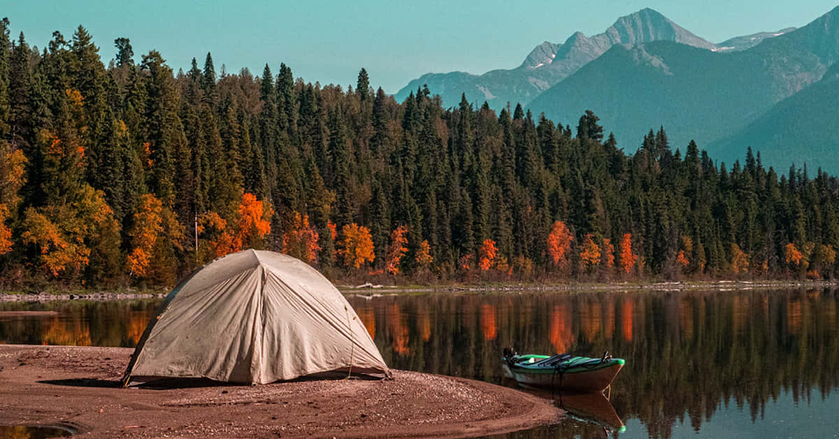 Cozy Fall Camping at Scenic Lakeside Campsite Wallpaper