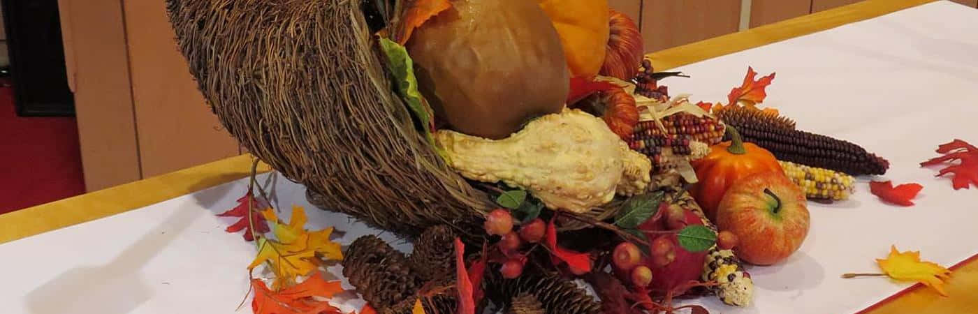 A bountiful fall cornucopia overflowing with autumn harvest Wallpaper