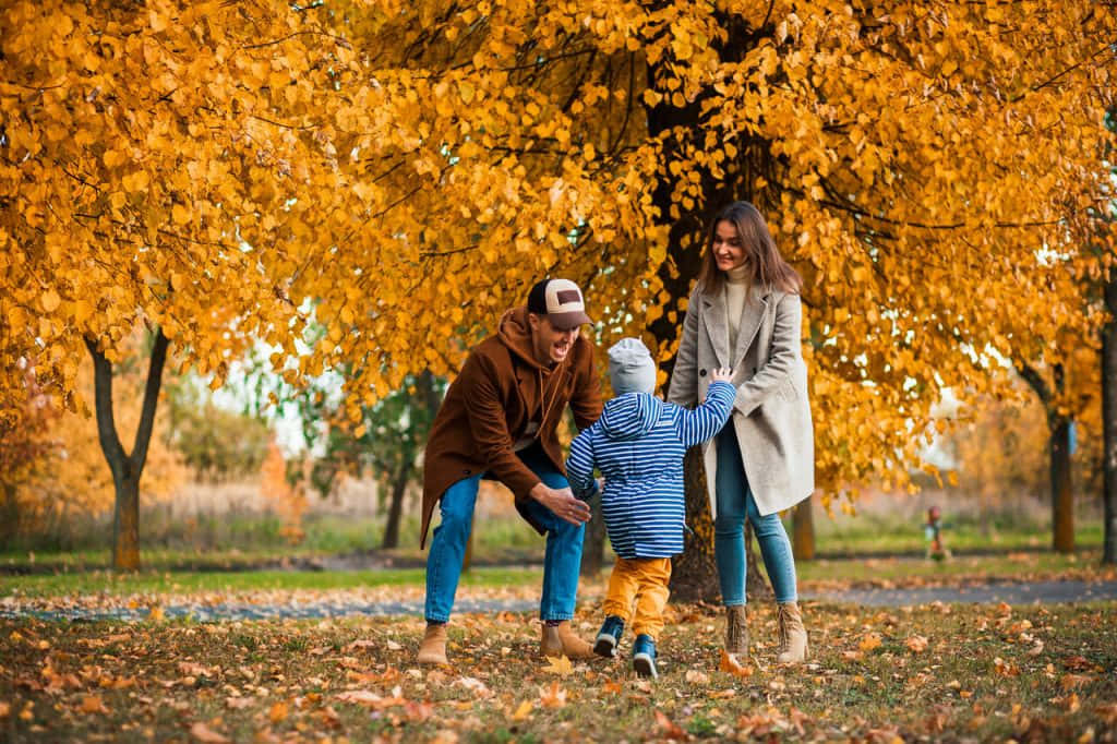 A joyous family enjoying a day of fall fun