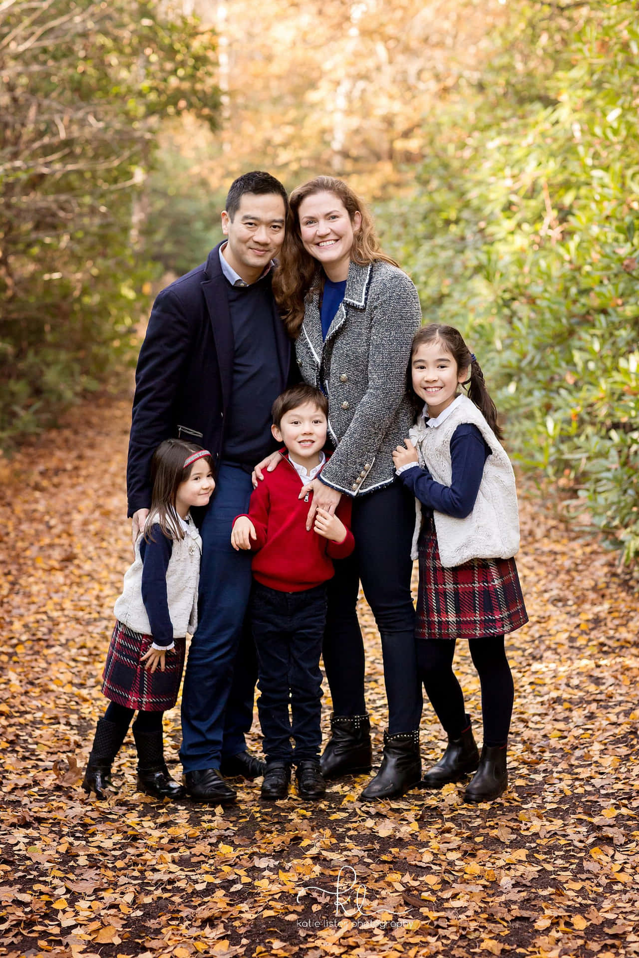 A Family Poses For A Photo In The Fall