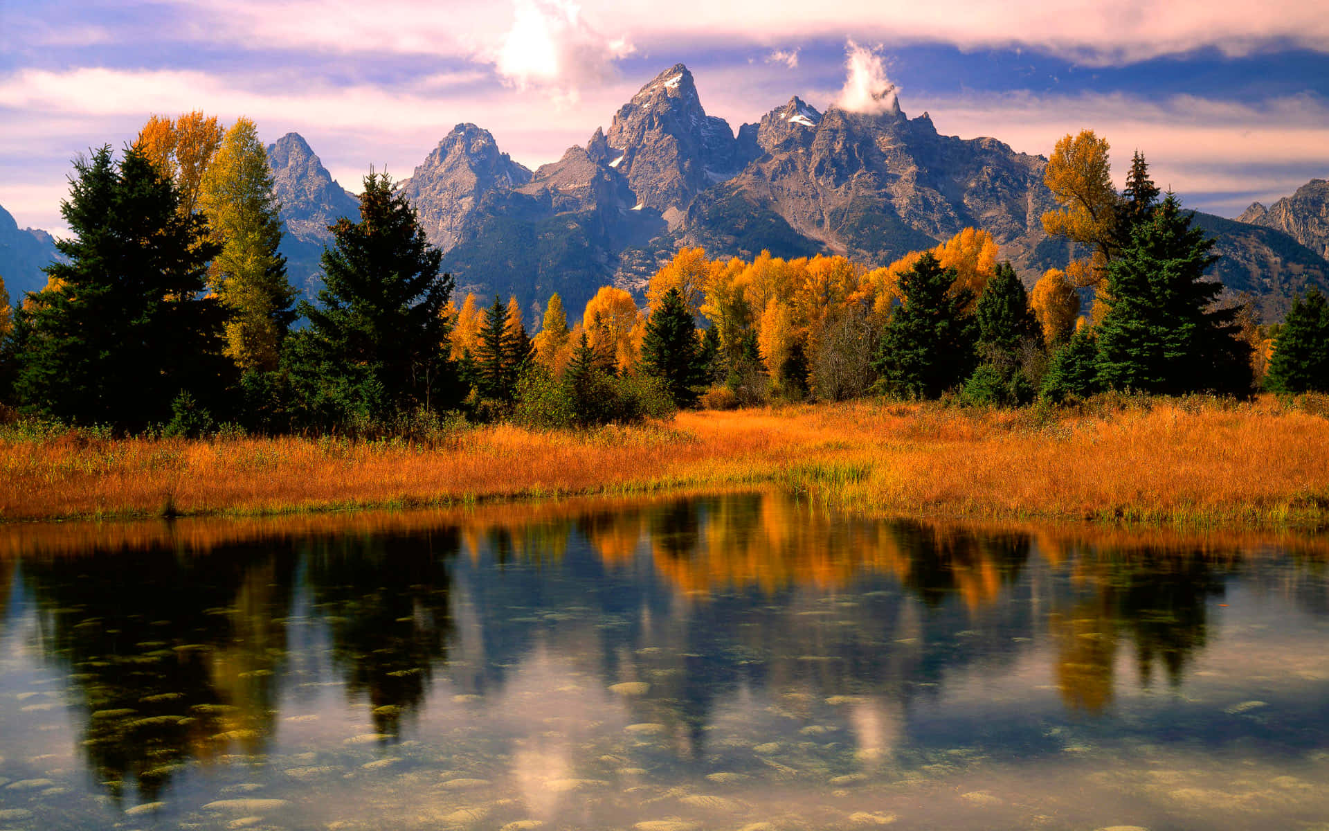 A Stunning Fall Landscape of Colorful Mountains Wallpaper