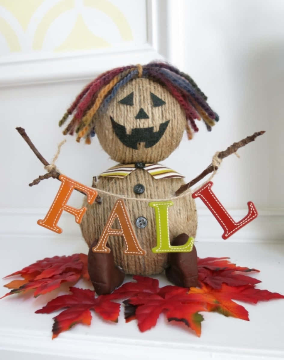 Enchanting Fall Scarecrow in a Rustic Field Wallpaper