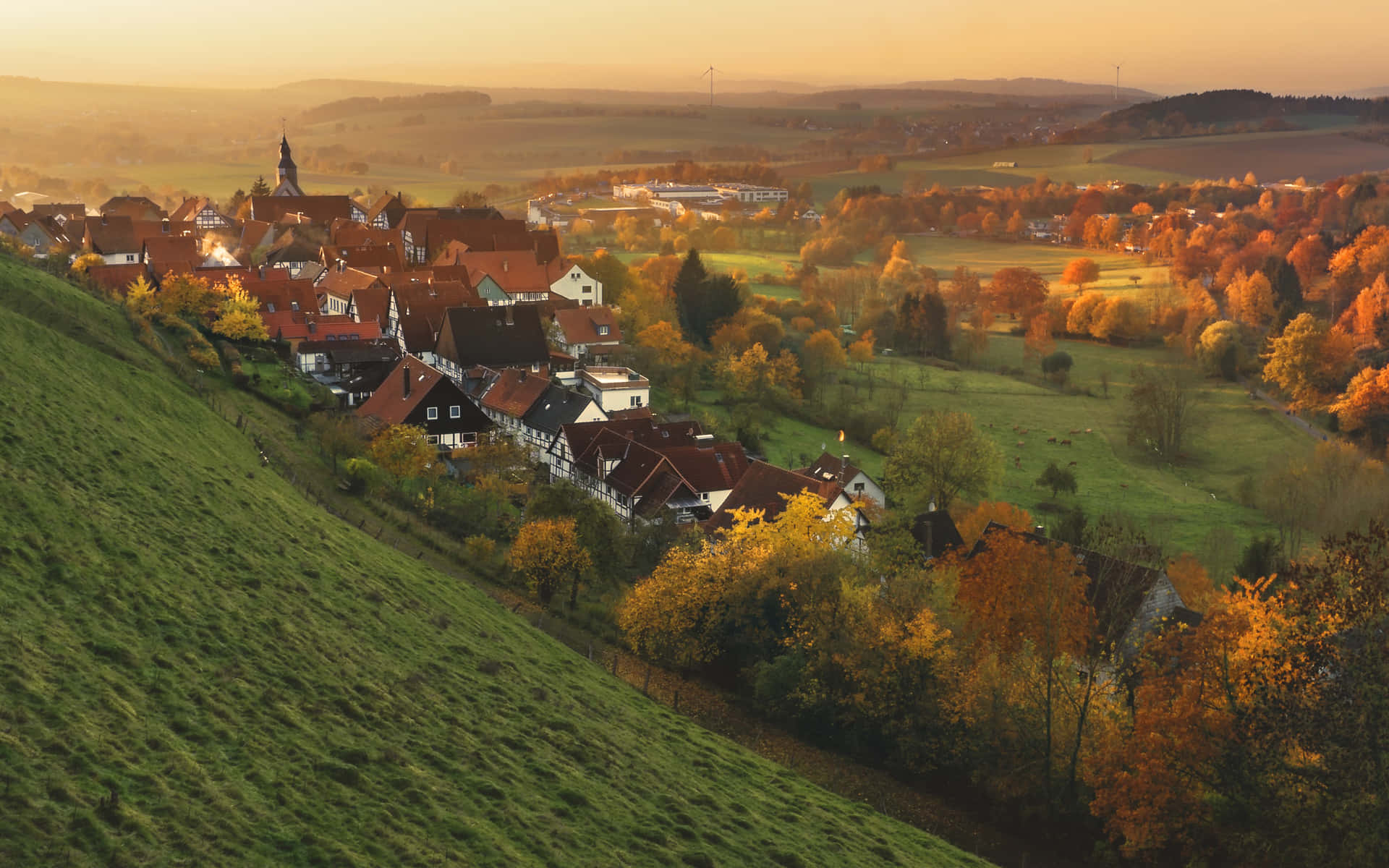 A picturesque Fall Town during peak autumn season Wallpaper