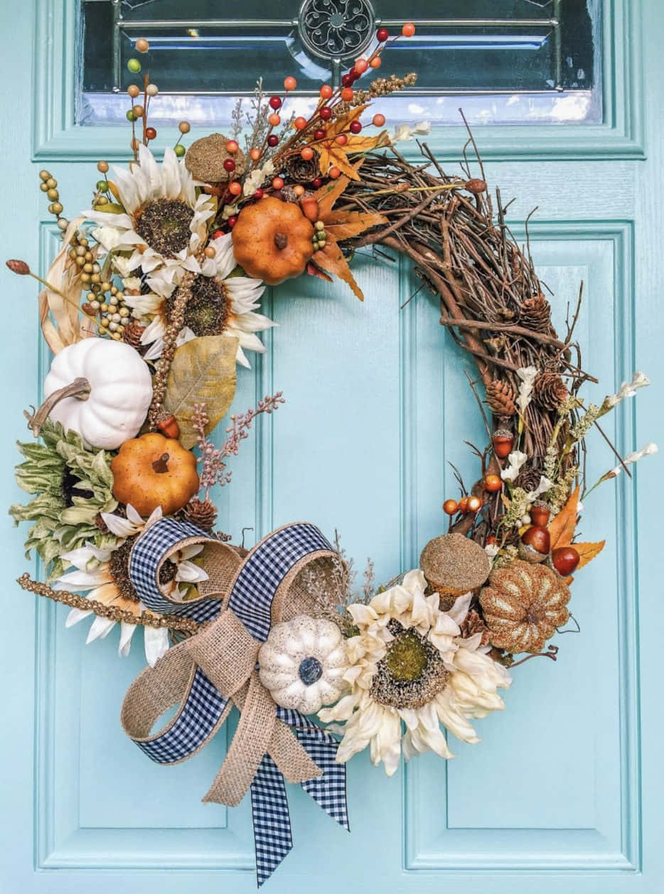 A Beautiful Fall Wreath on Wooden Door Wallpaper