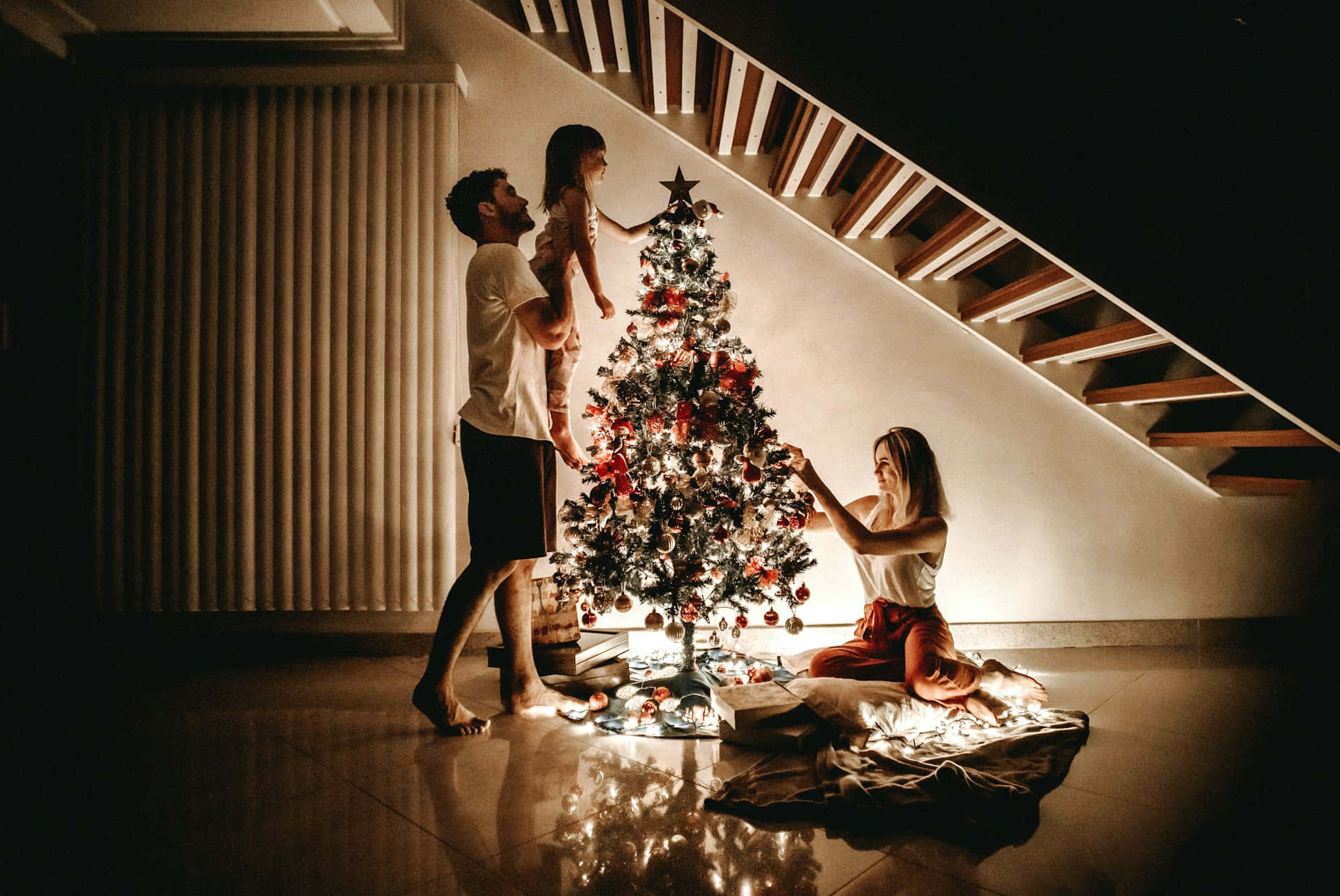 Family Decorating Christmas Tree Wallpaper