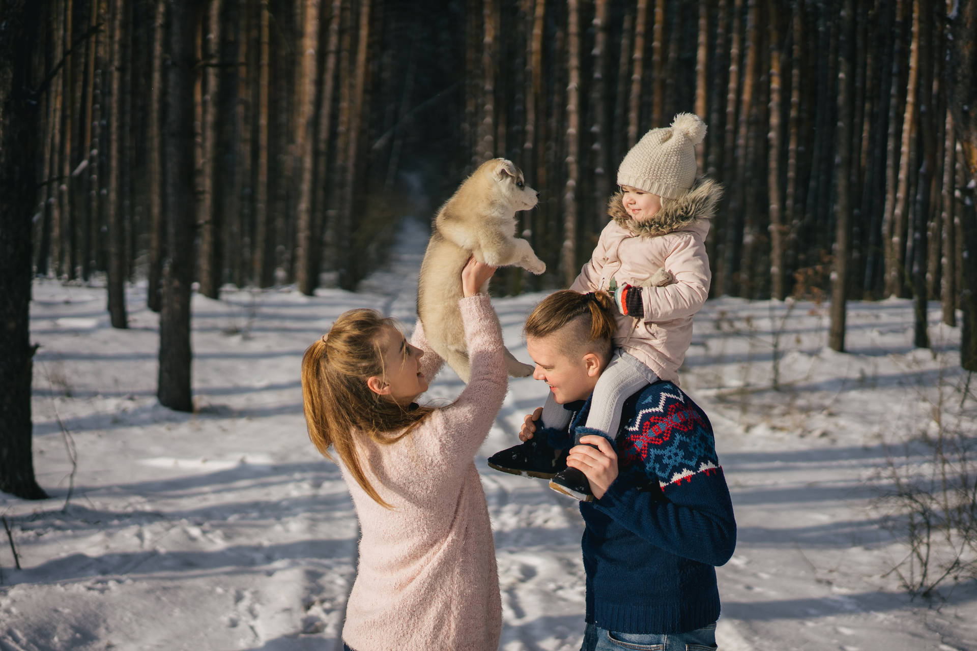 Family During Winter Season Wallpaper